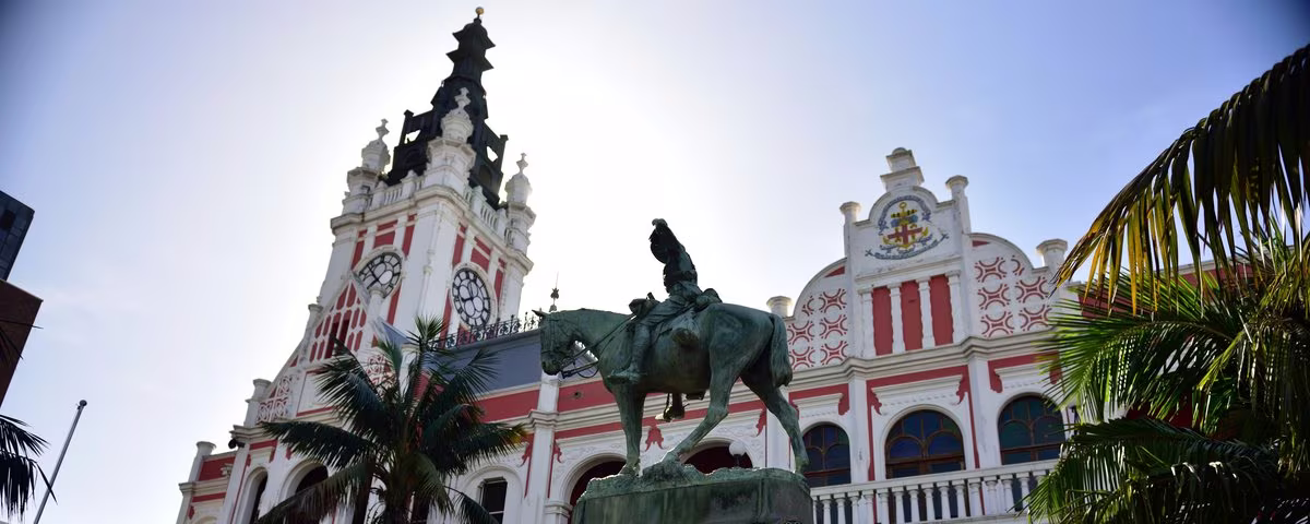 East London City Hall's clock tower behind the horse memorial statue